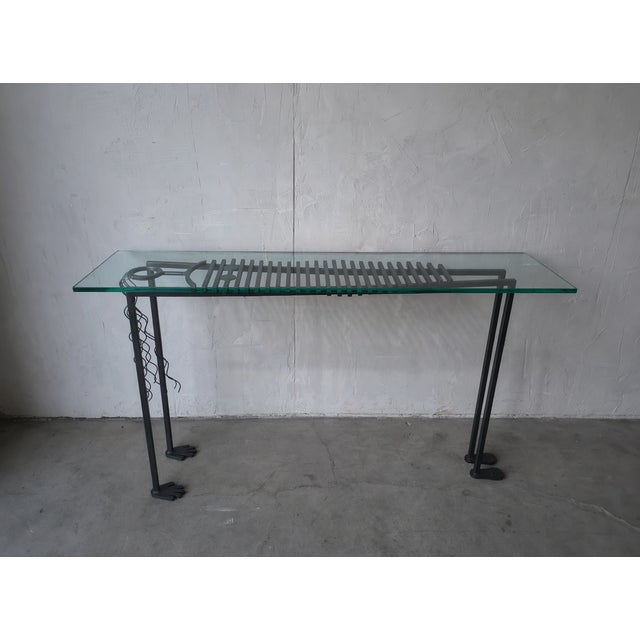 This Anthropomorphic “Iron Lady” console table is a highly sculptural, hand-wrought metal console table with a distinctly...