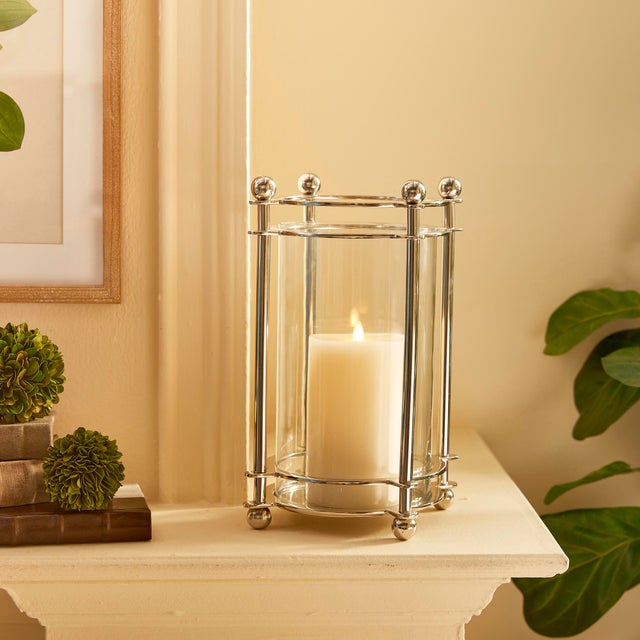 In a shiny chrome finish, this hurricane is a markedly handsome addition to your traditional decor. The cylindrical glass...