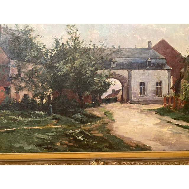 A beautifully atmospheric antique European landscape painting, oil on canvas, depicting a quiet village street framed by...