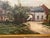 A beautifully atmospheric antique European landscape painting, oil on canvas, depicting a quiet village street framed by...