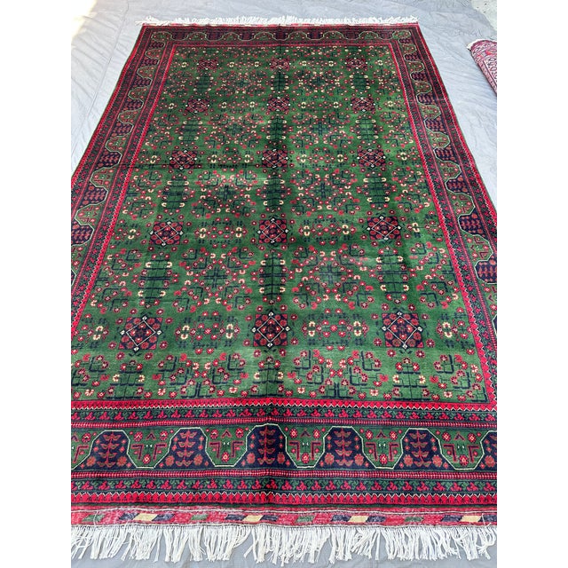 This Khal Mohammadi rug presents the design's signature scattered diamond medallions and floral rosettes across a rich...