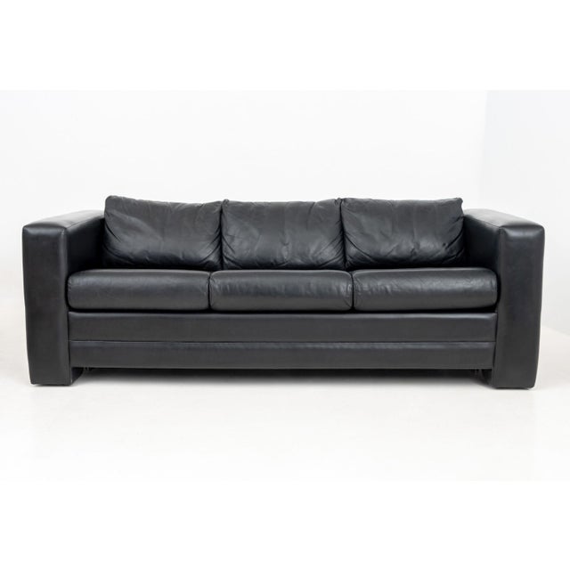 Modern Black Leather Upholstered Three-Seat Sleeper Sofa, with Queen size bed and Avery Boardman label beneath center...
