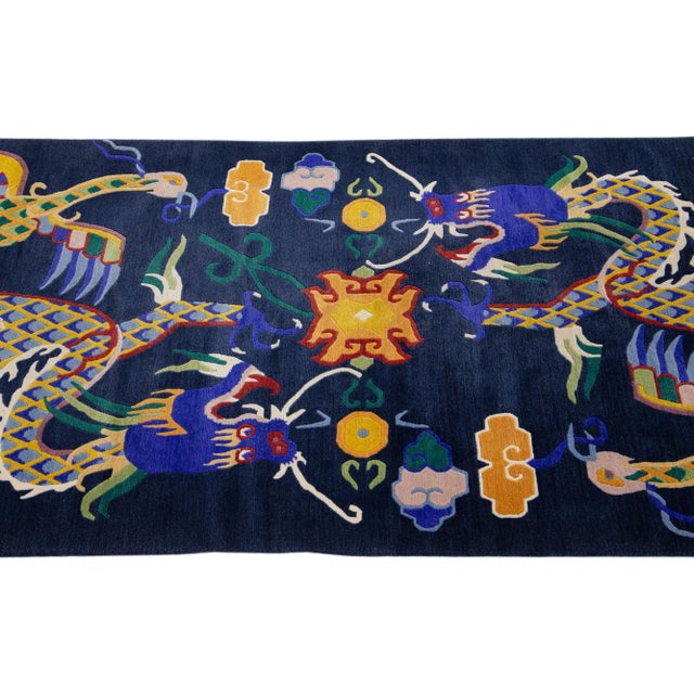 Beautiful antique Peking Chinese hand-knotted wool rug with a navy blue field and multi-color accents all-over traditional...