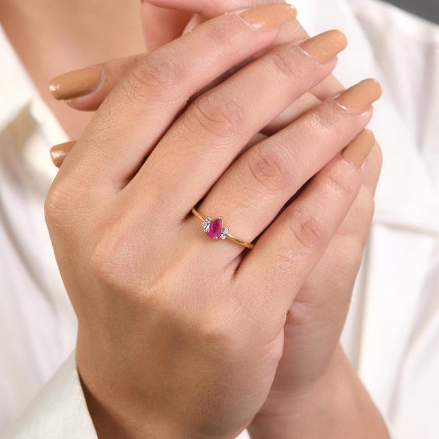 Dainty Pear Ruby Diamond Wedding Promise Ring for Her in 18K Gold featuring natural ruby of 0.45 carats and diamonds of...