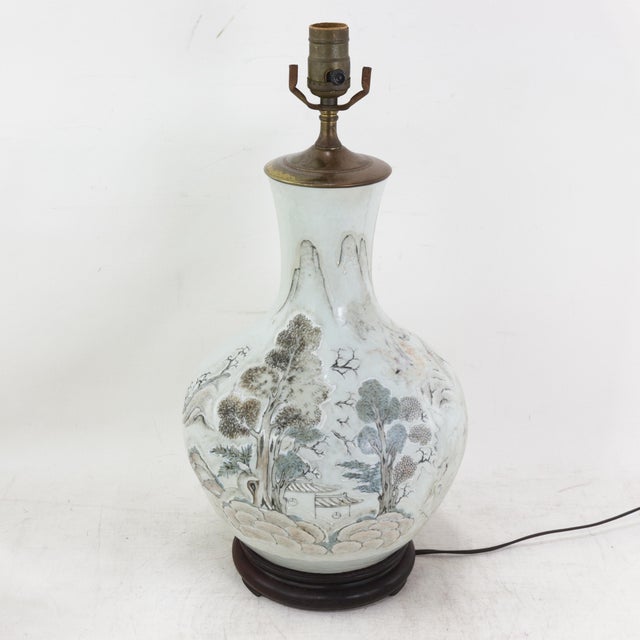 This antique table lamp is crafted from a stunning white porcelain vase featuring a traditional Chinese literati-style...