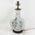 This antique table lamp is crafted from a stunning white porcelain vase featuring a traditional Chinese literati-style...