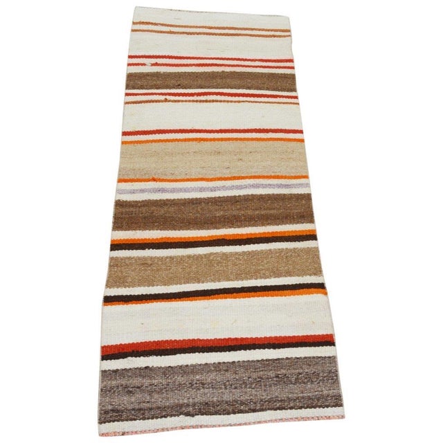 Vintage Turkish Anatolian hand woven wool kilim with natural colors and soft texture.