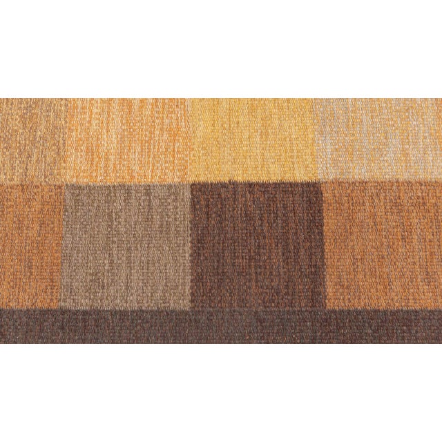Vintage Swedish flat weave rug by Ulla Parkdal Size: 5'2" × 7'10" (157 × 238 cm) Color: Beige, brown, gold, yellow. This...