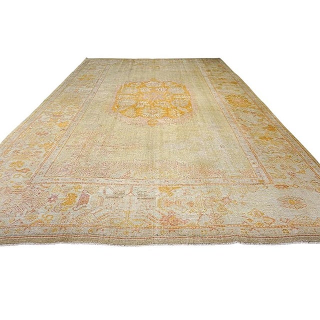 Antique Oushak Turkish Allover Medallion Rug, Country of Origin: Turkey, Circa Date: 1890s. This exceptional late 19th-...