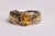 A stunning faceted, oval yellow sapphire ring with sterling silver with a hand-tooled 18K gold overlay. Ring size is 7.25....