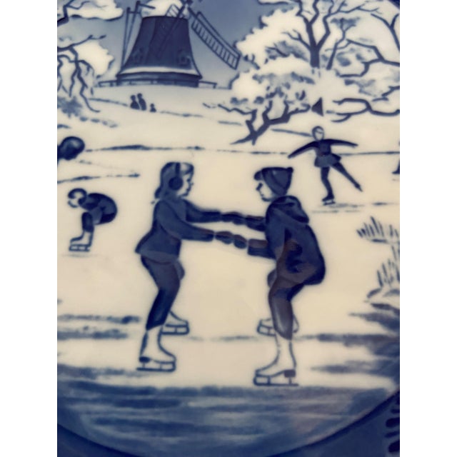 A charming 1989 Royal Copenhagen blue collector plate titled “The Old Skating Pond.” Crafted in Denmark in the brand’s...