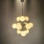 Sputnik pendant lamp with a 1960s space age design, produced by Reggiani. Chromed metal structure with 12 arms and 12...