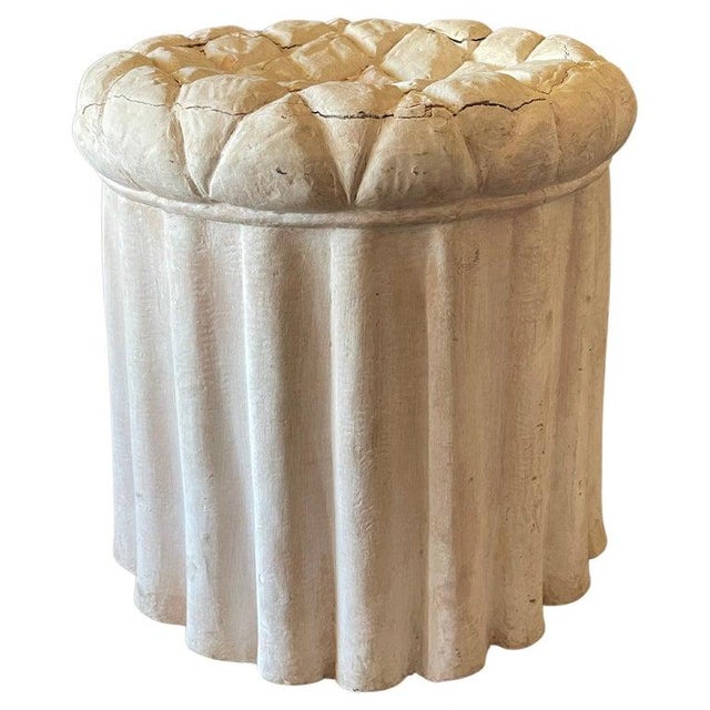 Trompe L’oeil plaster ottoman stool with a quilted top and draped skirt, in the manner of Serge Roche.