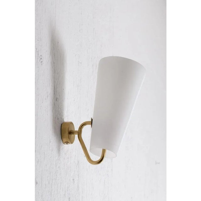 Rare model, brass and opaline glass shade. Up to 250V (Europe/UK Standard).The wiring of this item may be original and...