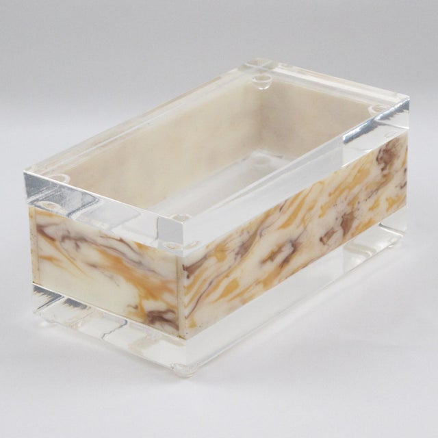 This stunning modernist Lucite box was crafted in the 1970s. Its rectangular shape boasts a crystal-clear Lucite or...