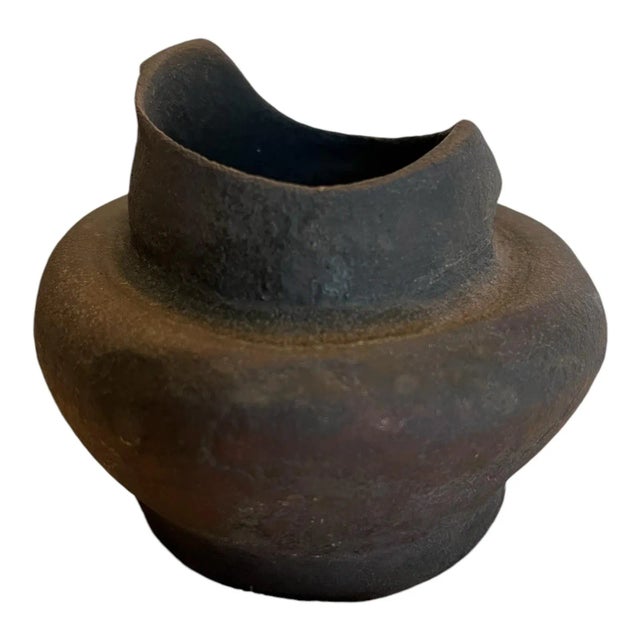 Petite handcrafted clay vase in an ebony tone. Crafted in Brazil, signed by artist on base.