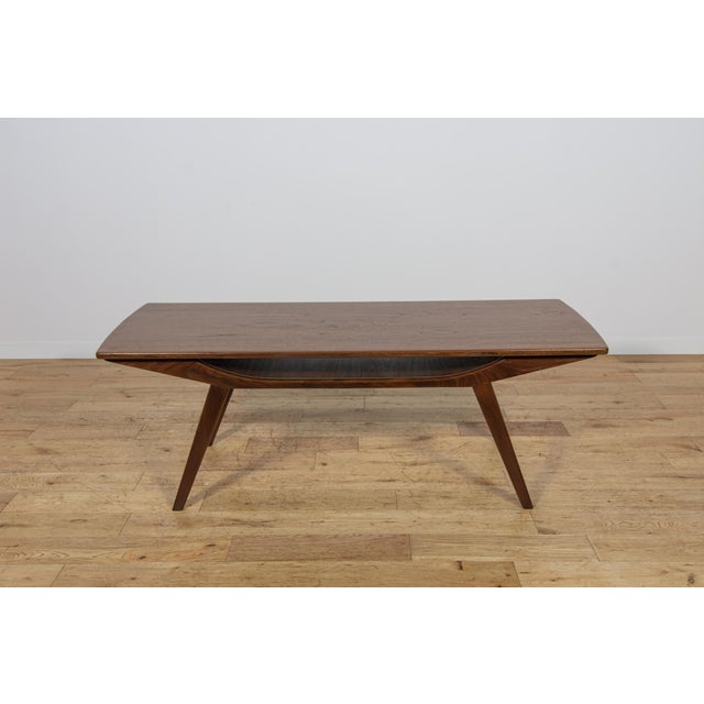 This coffee table, with its light, refined form and exquisite craftsmanship, was made of teak wood in the 1960s in...