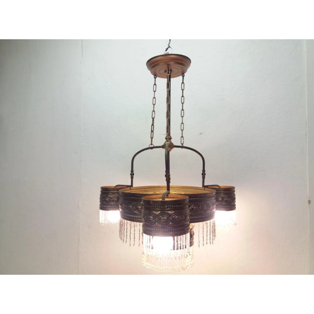 Good original condition. Metal construction with a copper patina. Originally a gas chandelier converted into an electric...