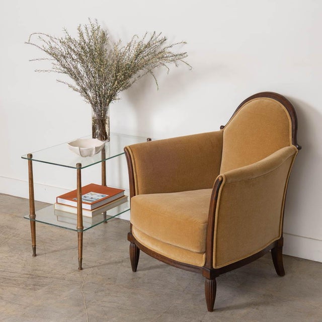 Stunning rectangular two-tier wood and glass table from France, 1950s. Glass top and lower shelf with four wood legs and...