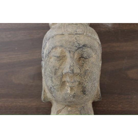 Authentic Northern Wei Dynasty carved stone Buddha head fragment, dating to the 4th-6th century AD. The sculpture displays...