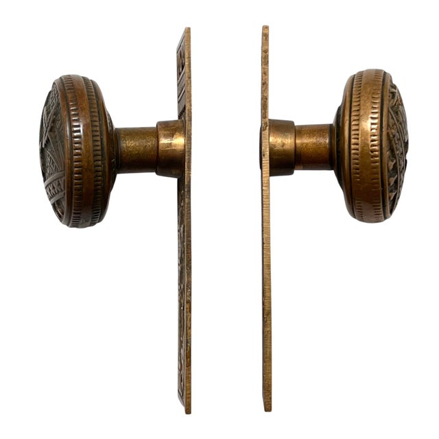 Add a finishing touch to your favorite door with this eclectic pair of American bronze door knobs with matching bronze...