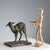 Bronze sculpture depicting a lamb on a marble base. Engraved signature of the artist. This piece is attributed to the...