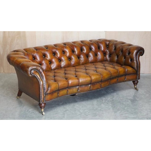 An exceptionally rare and magnificent pair of original early Victorian Howard & Sons (Berners Street) cigar brown leather,...