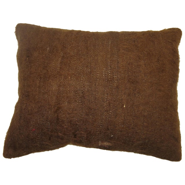 A pillow made with a brown Turkish Mohair rug.