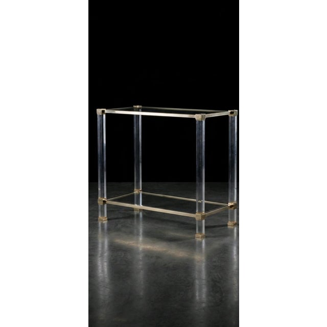 70s Modern Console table in the manner of Pierre Vandel featuring a glass top and lower glass tier both framed with a...