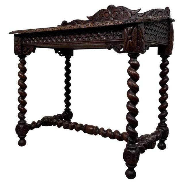 A superb and highly decorative 19th-century English Victorian writing table, beautifully constructed in oak and...