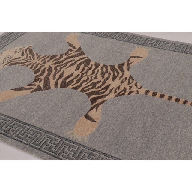 Hand-knotted in wool, this 6x9 rug is a striking new addition to our Distressed Homage collection, inspired by a mid-...