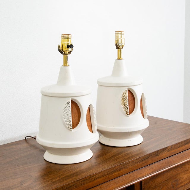 Set of 2 round ceramic and wood American designed mid century lamps. Unique mix of mediums used to produce these. Hard to...