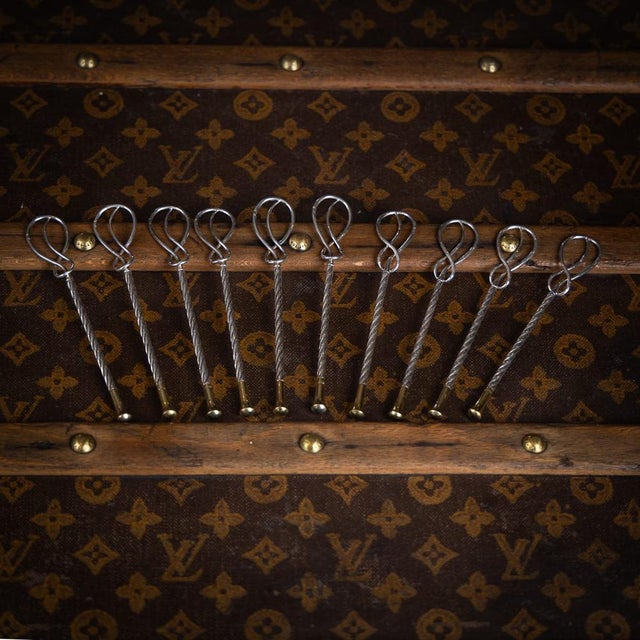 A 20th century set of 10 french gilt solid silver champagne stirrers by hermès, paris. The set includes ten stirrers....