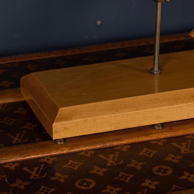 A 20th Century articulated wooden horse on a brass stand with a wooden base, featuring movement in all four legs, head,...