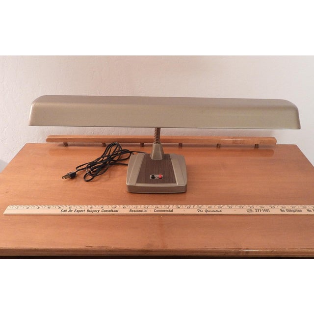 This marvelous vintage 1970s gooseneck desk lamp is created with a gorgeous gray matte metal shade, a gold gooseneck that...