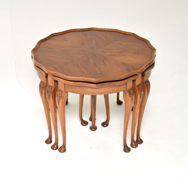A beautiful and very useful antique figured walnut pie crust nesting coffee table. This was made in England, it dates from...