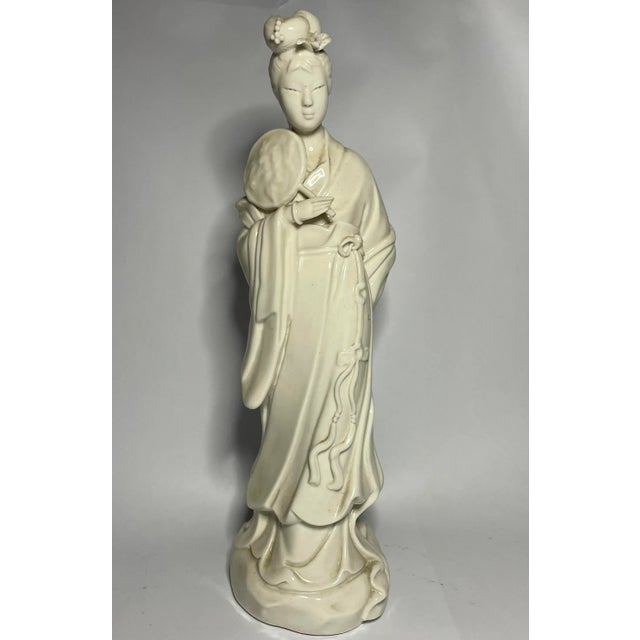 This creamy white blanc de chine figurine comes from the 19th century Qing dynasty. It can be dated to pre-20th century...
