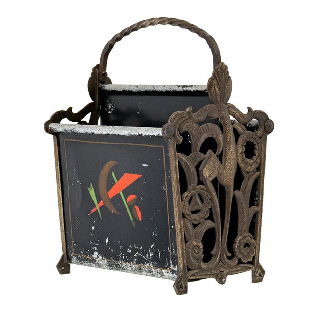 Antique 1920s Art Deco magazine rack featuring ornate cast metal side panels with a stylized gazelle framed by scrollwork,...