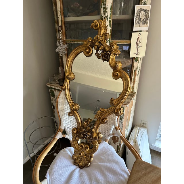 This original Regency Style "French" mirror has the mix of wood framing, gilt, and the hand made roses attached to the top...