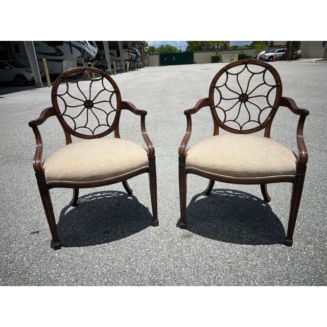 Elegant armchairs in the manor of Maitland smith features a striking spider web back design. Crafted with meticulous...
