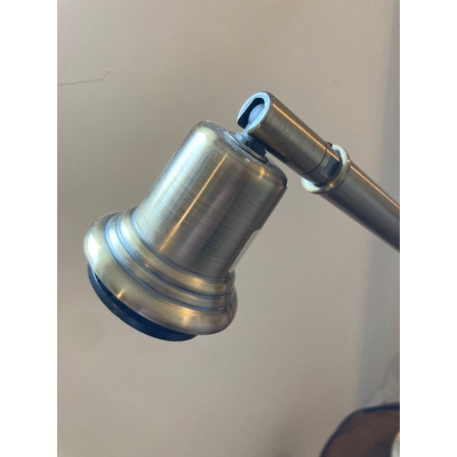 This is a vintage 1999 articulating desk lamp from the Massachusetts based company “Lite Source”. Metal with a subtle...