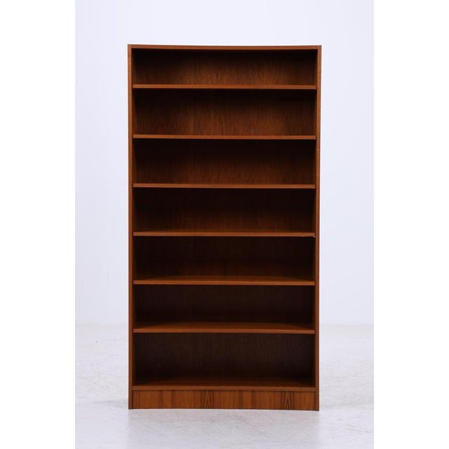 A simple mid-century bookcase with a beautiful teak grain. The open shelves create a light and airy feel while offering...