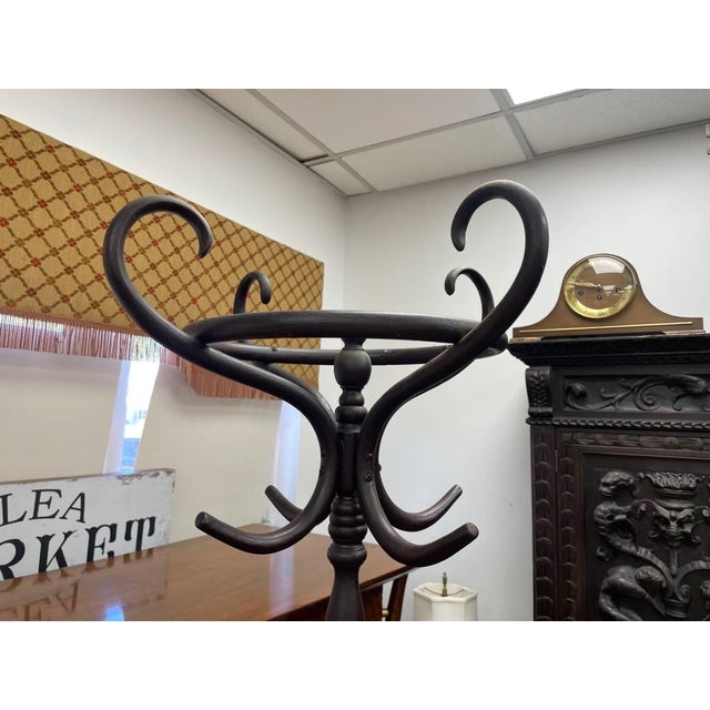 For sale is an antique Coat hanger rack made of genuine rattan. Rattan is a wood like palm that is flexible and allows the...