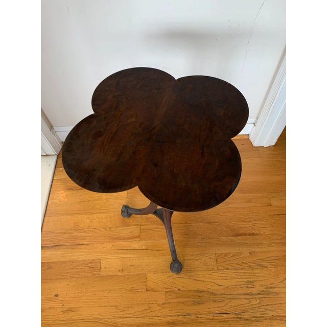 A beautiful Gueridon butterfly table with uniquely carved pedestal support which dovetails into three curved feet with...