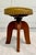 Here is a fantastic, antique swivel stool that features a solid wood base with an upholstered seat. Please let us look at...