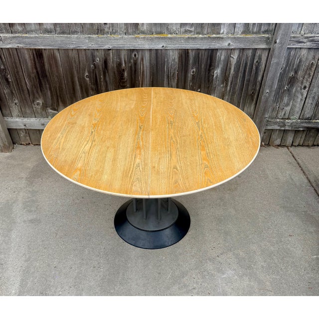 Vintage extension table made in Italy and attributed to Peter Maly for Tonon c, 1990. Light cerused wood top with 19-inch...