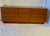 1960’s teak (9) drawer dresser in style of Nils Jonnson for Sun Cabinets. The curved sides with recessed plinth base and...