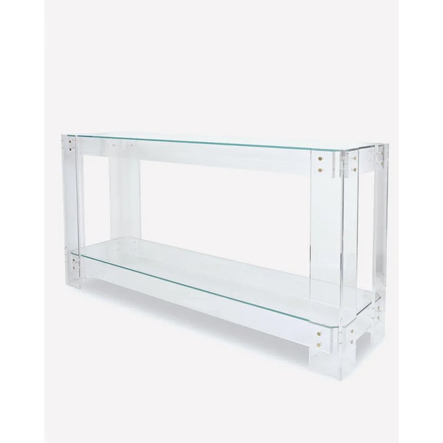 Essential lines and formal minimalism characterise the design of this clean console table of lucite origin. Paired with...