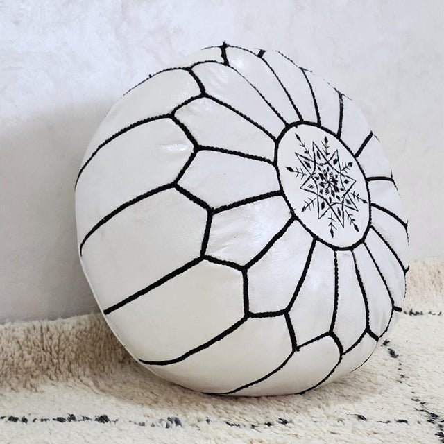 Moroccan pouf made by our skilled craftsmen from the finest quality goatskin leather, processed naturally by hand. This...