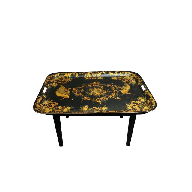 Hand painted tole tray coffee table in gold and black with bird decoration.